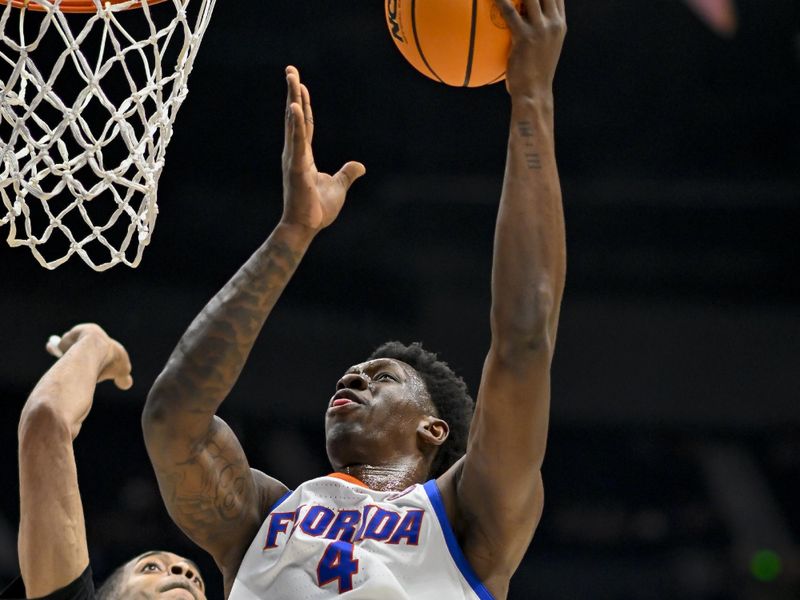 Mar 14, 2024; Nashville, TN, USA;  Florida Gators forward Tyrese Samuel (4) lays the ball up against the Georgia Bulldogs during the second half at Bridgestone Arena. Mandatory Credit: Steve Roberts-USA TODAY Sports