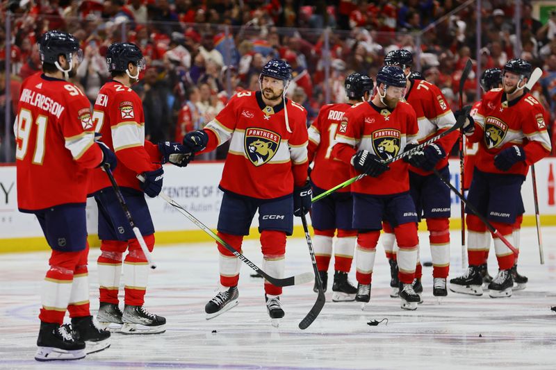 May 28, 2024; Sunrise, Florida, USA; Florida Panthers center Sam Reinhart (13) celebrates with teammates after an overtime win against the New York Rangers in game four of the Eastern Conference Final of the 2024 Stanley Cup Playoffs at Amerant Bank Arena. Mandatory Credit: Sam Navarro-USA TODAY Sports