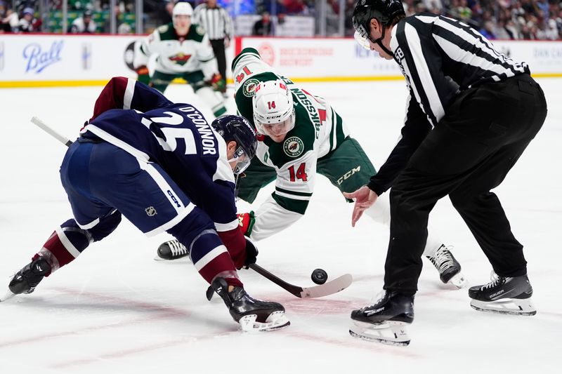 Jan 20, 2025; Denver, Colorado, USA;NHL linesman Ryan Gibbons (58) drops the puck for Colorado Avalanche right wing Logan O'Connor (25) and Minnesota Wild center Joel Eriksson Ek (14) in the first period at Ball Arena. Mandatory Credit: Ron Chenoy-Imagn Images