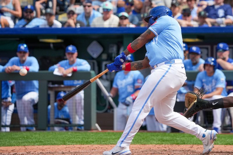 Jun 2, 2024; Kansas City, Missouri, USA; Kansas City Royals outfielder Nelson Velázquez (17) hits a two-run triple against the San Diego Padres in the ninth inning at Kauffman Stadium. Mandatory Credit: Denny Medley-USA TODAY Sports