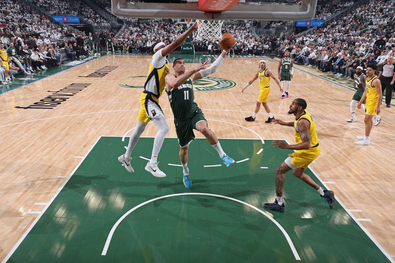 MILWAUKEE, WI - APRIL 23: Brook Lopez #11 of the Milwaukee Bucks drives to the basket during Round 1 Game 2 of the 2024 NBA Playoffs against the Indiana Pacers on April 23, 2024 at the Fiserv Forum Center in Milwaukee, Wisconsin. NOTE TO USER: User expressly acknowledges and agrees that, by downloading and or using this Photograph, user is consenting to the terms and conditions of the Getty Images License Agreement. Mandatory Copyright Notice: Copyright 2024 NBAE (Photo by Jeff Haynes/NBAE via Getty Images).