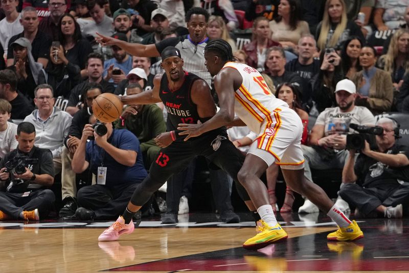 MIAMI, FL - JANUARY 19: Bam Adebayo #13 of the Miami Heat dribbles the ball during the game against the Atlanta Hawks on January 19, 2024 at Kaseya Center in Miami, Florida. NOTE TO USER: User expressly acknowledges and agrees that, by downloading and or using this Photograph, user is consenting to the terms and conditions of the Getty Images License Agreement. Mandatory Copyright Notice: Copyright 2024 NBAE (Photo by Eric Espada/NBAE via Getty Images)