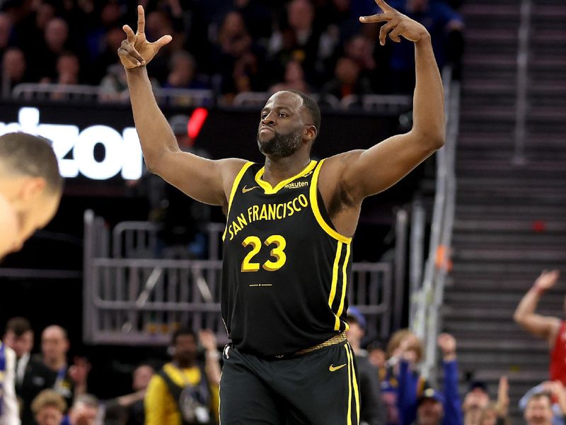 SAN FRANCISCO, CALIFORNIA - MARCH 06: Draymond Green #23 of the Golden State Warriors reacts after making a three-point basket against the Milwaukee Bucks in the second half at Chase Center on March 06, 2024 in San Francisco, California. NOTE TO USER: User expressly acknowledges and agrees that, by downloading and or using this photograph, User is consenting to the terms and conditions of the Getty Images License Agreement.  (Photo by Ezra Shaw/Getty Images)