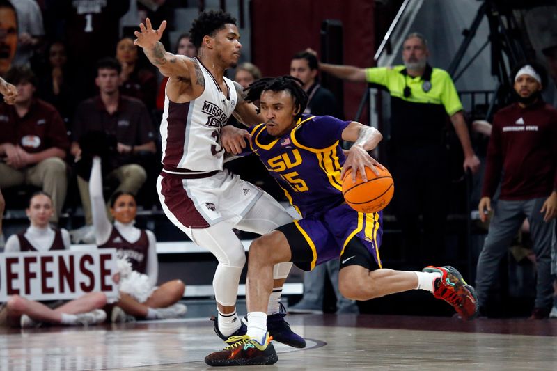 Feb 8, 2023; Starkville, Mississippi, USA; LSU Tigers forward Tyrell Ward (15) drives to the basket as Mississippi State Bulldogs guard Shakeel Moore (3) defends during the first half at Humphrey Coliseum. Mandatory Credit: Petre Thomas-USA TODAY Sports