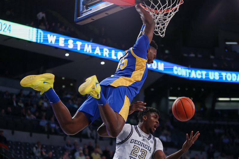 Jan 23, 2024; Atlanta, Georgia, USA; Pittsburgh Panthers forward Zack Austin (55) dunks past Georgia Tech Yellow Jackets forward Ibrahima Sacko (23) in the first half at McCamish Pavilion. Mandatory Credit: Brett Davis-USA TODAY Sports
