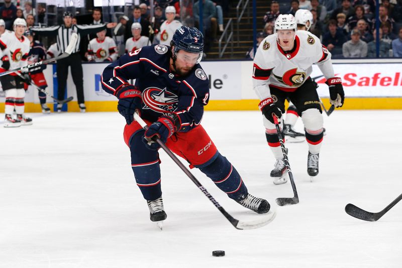 Mar 14, 2024; Columbus, Ohio, USA; Columbus Blue Jackets defenseman Ivan Provorov (9) tracks down a loose puck against the Ottawa Senators during the first period at Nationwide Arena. Mandatory Credit: Russell LaBounty-USA TODAY Sports