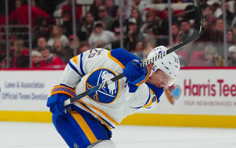 Dec 2, 2023; Raleigh, North Carolina, USA; Buffalo Sabres defenseman Rasmus Dahlin (26) takes a shot against the Carolina Hurricanes during the second period at PNC Arena. Mandatory Credit: James Guillory-USA TODAY Sports