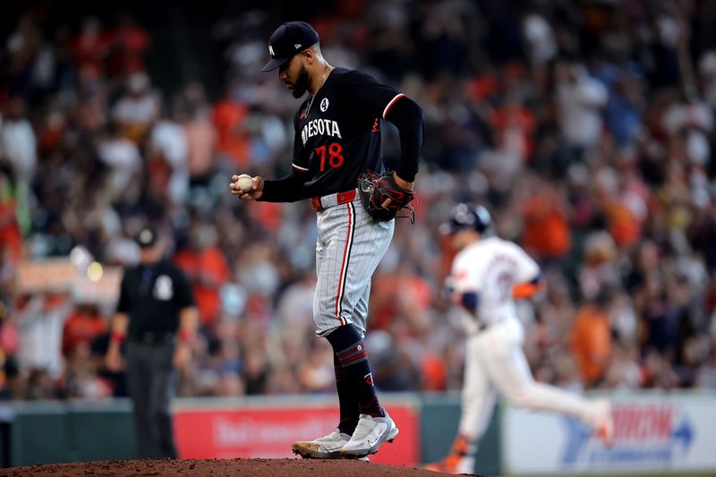 Jun 2, 2024; Houston, Texas, USA; Minnesota Twins starting pitcher Simeon Woods Richardson (78) reacts after giving up a home run to Houston Astros catcher Victor Caratini (17) during the second inning at Minute Maid Park. Mandatory Credit: Erik Williams-USA TODAY Sports