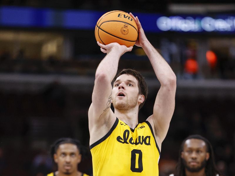 Mar 9, 2023; Chicago, IL, USA; Iowa Hawkeyes forward Filip Rebraca (0) shoots a free throw against the Ohio State Buckeyes during the second half at United Center. Mandatory Credit: Kamil Krzaczynski-USA TODAY Sports