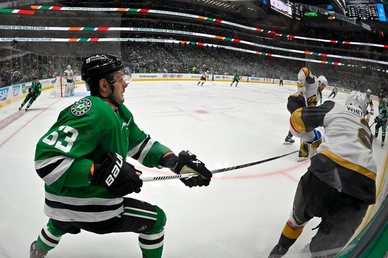 Apr 24, 2024; Dallas, Texas, USA; Dallas Stars right wing Evgenii Dadonov (63) and Vegas Golden Knights defenseman Zach Whitecloud (2) battle for control of the puck during the second period in game two of the first round of the 2024 Stanley Cup Playoffs at American Airlines Center. Mandatory Credit: Jerome Miron-USA TODAY Sports