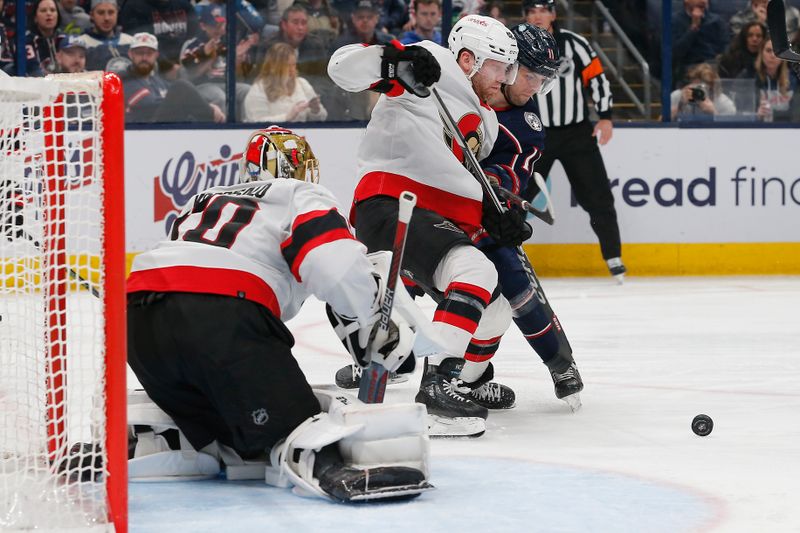 Dec 1, 2023; Columbus, Ohio, USA; Ottawa Senators center Rourke Chartier (49) and Columbus Blue Jackets center Adam Fantilli (11) chase after a rebound of a  Joonas Korpisalo (70) save during the second period at Nationwide Arena. Mandatory Credit: Russell LaBounty-USA TODAY Sports