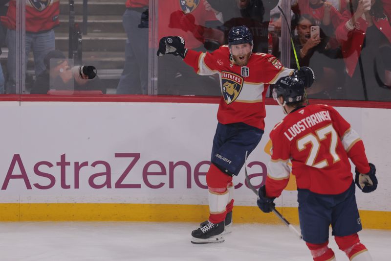Jun 9, 2025; Sunrise, Florida, USA; Florida Panthers forward Sam Bennett (9) celebrates scoring during the second period against the Edmonton Oilers with forward Eetu Luostarinen (27) in game three of the 2025 Stanley Cup Final at Amerant Bank Arena. Mandatory Credit: Sam Navarro-Imagn Images