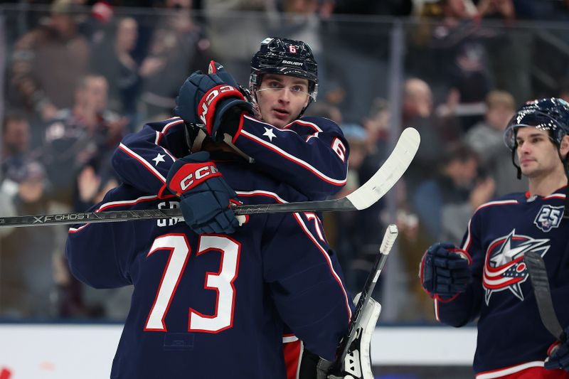 Jan 24, 2026; Columbus, Ohio, USA;  Columbus Blue Jackets defenseman Egor Zamula (6) celebrates with Columbus Blue Jackets goaltender Jet Greaves (73) following the game against the Tampa Bay Lightning at Nationwide Arena. Mandatory Credit: Joseph Maiorana-Imagn Images