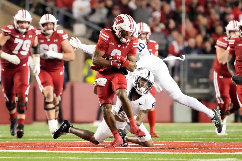 Oct 26, 2024; Madison, Wisconsin, USA;  Wisconsin Badgers wide receiver Will Pauling (6) rushes with the football after catching a pass during the second quarter against the Penn State Nittany Lions at Camp Randall Stadium. Mandatory Credit: Jeff Hanisch-Imagn Images