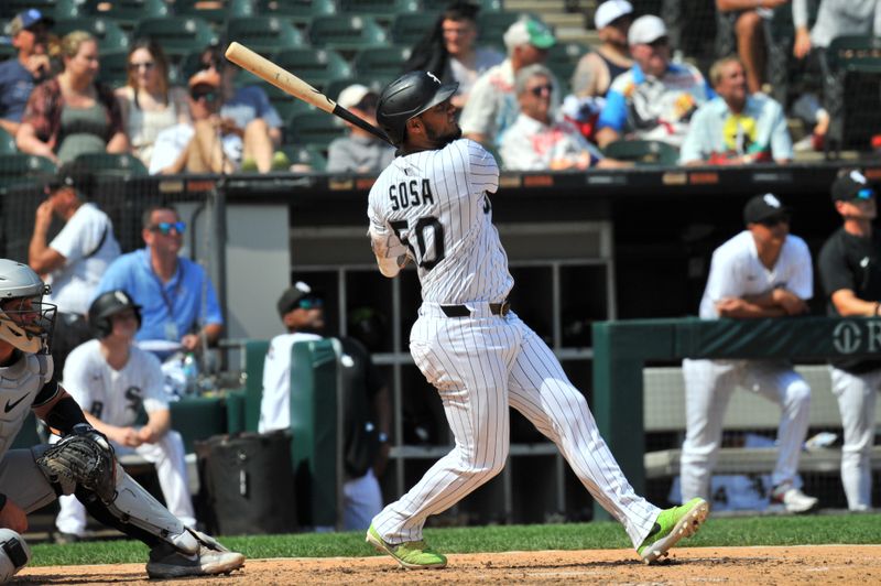 Jun 25, 2025; Chicago, Illinois, USA; Chicago White Sox second baseman Lenyn Sosa (50) hits a home run during the eighth inning against the Arizona Diamondbacks at Rate Field. Mandatory Credit: Patrick Gorski-Imagn Images