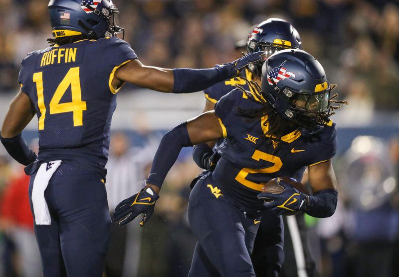 Nov 4, 2023; Morgantown, West Virginia, USA; West Virginia Mountaineers safety Aubrey Burks (2) celebrates after recovering a fumble during the second quarter against the Brigham Young Cougars at Mountaineer Field at Milan Puskar Stadium. Mandatory Credit: Ben Queen-USA TODAY Sports