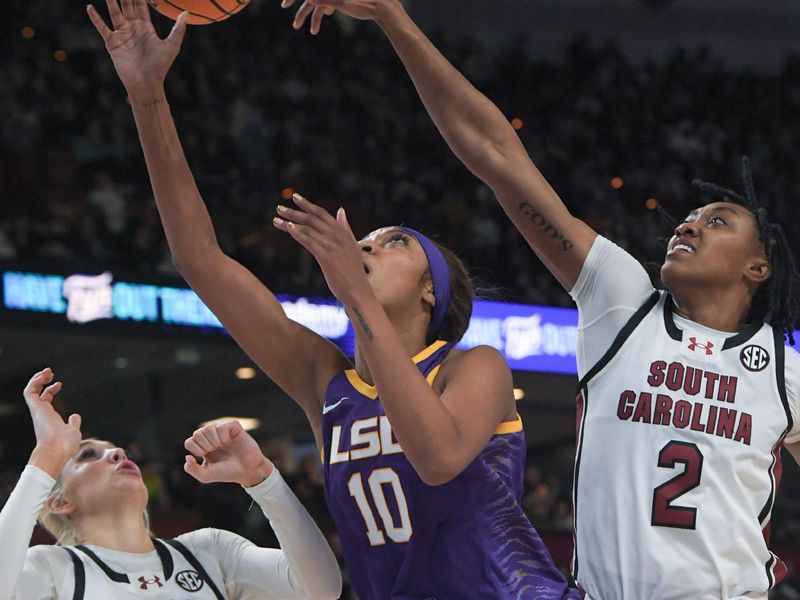 Mar 10, 2024; Greensville, SC, USA; South Carolina forward Ashlyn Watkins (2) blocks a shot by Louisiana State University forward Angel Reese (10) during the fourth quarter of the SEC Women's Basketball Tournament Championship game at the Bon Secours Wellness Arena. Mandatory Credit: Ken Ruinard-USA TODAY Sports via Greenville News
 