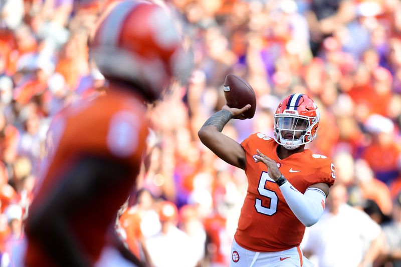 Sep 11, 2021; Clemson, South Carolina, USA; Clemson Tigers quarterback D.J. Uiagalelei (5) looks to throw against the South Carolina State Bulldogs during the first quarter at Memorial Stadium. Mandatory Credit: Adam Hagy-USA TODAY Sports