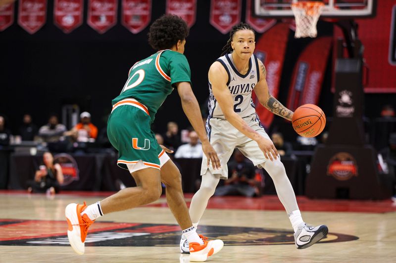 Nov 28, 2025; Kissimmee, FL, USA; Miami (FL) Hurricanes guard Tru Washington (10) guards Georgetown Hoyas guard Malik Mack (2) in the first half  during the ESPN Events Invitational at State Farm Field House. Mandatory Credit: Nathan Ray Seebeck-Imagn Images