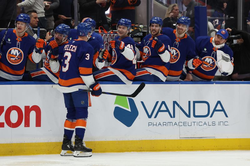 Jan 3, 2026; Elmont, New York, USA;  New York Islanders defenseman Adam Pelech (3) celebrates after scoring a goal against the Toronto Maple Leafs during the second period at UBS Arena. Mandatory Credit: Thomas Salus-Imagn Images