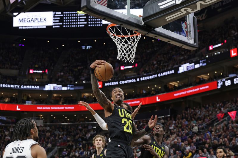 SALT LAKE CITY, UT - MARCH 27: John Collins #20 of the Utah Jazz rebounds the ball during the game against the San Antonio Spurs on March 27, 2024 at Delta Center in Salt Lake City, Utah. NOTE TO USER: User expressly acknowledges and agrees that, by downloading and or using this Photograph, User is consenting to the terms and conditions of the Getty Images License Agreement. Mandatory Copyright Notice: Copyright 2024 NBAE (Photo by Chris Nicoll/NBAE via Getty Images)