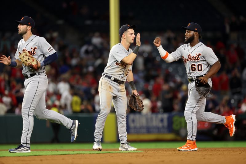 Sep 16, 2023; Anaheim, California, USA;  Detroit Tigers second baseman Zack Short (59) and left fielder Akil Baddoo (60) celebrate a victory after defeating the Los Angeles Angels 5-4 at Angel Stadium. Mandatory Credit: Kiyoshi Mio-USA TODAY Sports