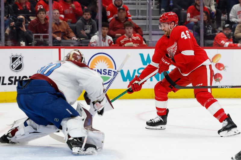 Feb 22, 2024; Detroit, Michigan, USA;  Detroit Red Wings defenseman Jeff Petry (46) skates with the puck on Colorado Avalanche goaltender Justus Annunen (60) in the second period at Little Caesars Arena. Mandatory Credit: Rick Osentoski-USA TODAY Sports