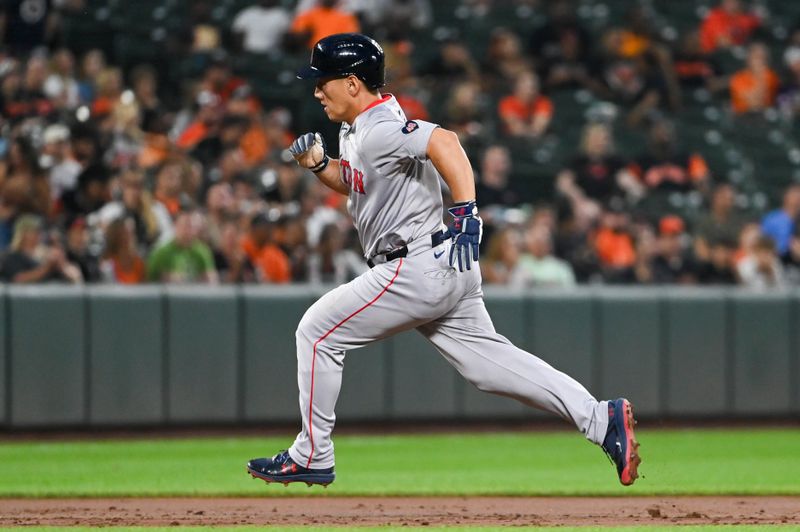 Aug 16, 2024; Baltimore, Maryland, USA;  Boston Red Sox left fielder Masataka Yoshida (7) runs to third base during the third inning against the Baltimore Orioles at Oriole Park at Camden Yards. Mandatory Credit: Tommy Gilligan-USA TODAY Sports