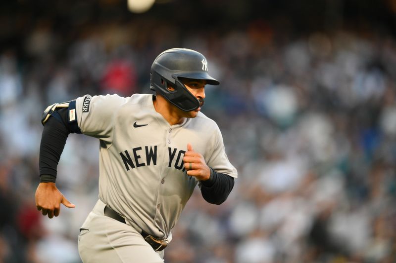 May 12, 2025; Seattle, Washington, USA; New York Yankees center fielder Trent Grisham (12) runs the bases after hitting a home run against the Seattle Mariners during the fifth inning at T-Mobile Park. Mandatory Credit: Steven Bisig-Imagn Images