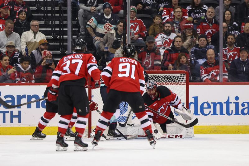 Dec 6, 2024; Newark, New Jersey, USA; New Jersey Devils goaltender Jacob Markstrom (25) makes a save against the Seattle Kraken during the second period at Prudential Center. Mandatory Credit: Ed Mulholland-Imagn Images