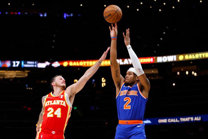 ATLANTA, GEORGIA - NOVEMBER 6: Miles McBride #2 of the New York Knicks shoots against Garrison Mathews #24 of the Atlanta Hawks during the first quarter at State Farm Arena on November 6, 2024 in Atlanta, Georgia. NOTE TO USER: User expressly acknowledges and agrees that, by downloading and or using this photograph, User is consenting to the terms and conditions of the Getty Images License Agreement. (Photo by Todd Kirkland/Getty Images)