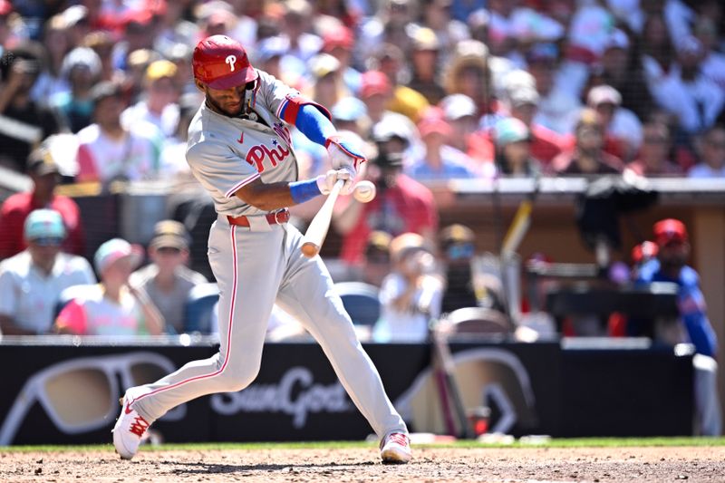 Apr 28, 2024; San Diego, California, USA; Philadelphia Phillies center fielder Johan Rojas (18) hits an RBI double against the San Diego Padres during the eighth inning at Petco Park. Mandatory Credit: Orlando Ramirez-USA TODAY Sports