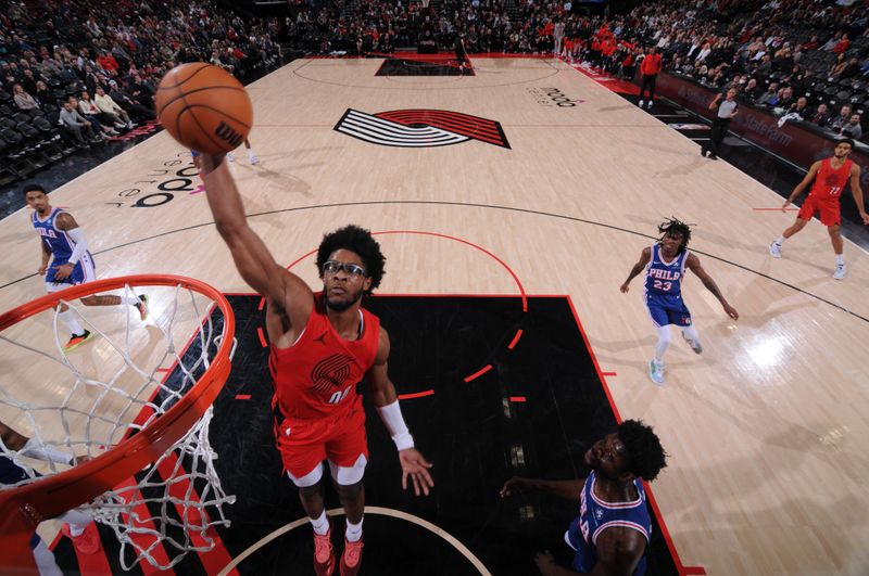 PORTLAND, OR - JANUARY 29: Scoot Henderson #00 of the Portland Trail Blazers dunks the ball during the game against the Philadelphia 76ers on January 29, 2024 at the Moda Center Arena in Portland, Oregon. NOTE TO USER: User expressly acknowledges and agrees that, by downloading and or using this photograph, user is consenting to the terms and conditions of the Getty Images License Agreement. Mandatory Copyright Notice: Copyright 2024 NBAE (Photo by Cameron Browne/NBAE via Getty Images)