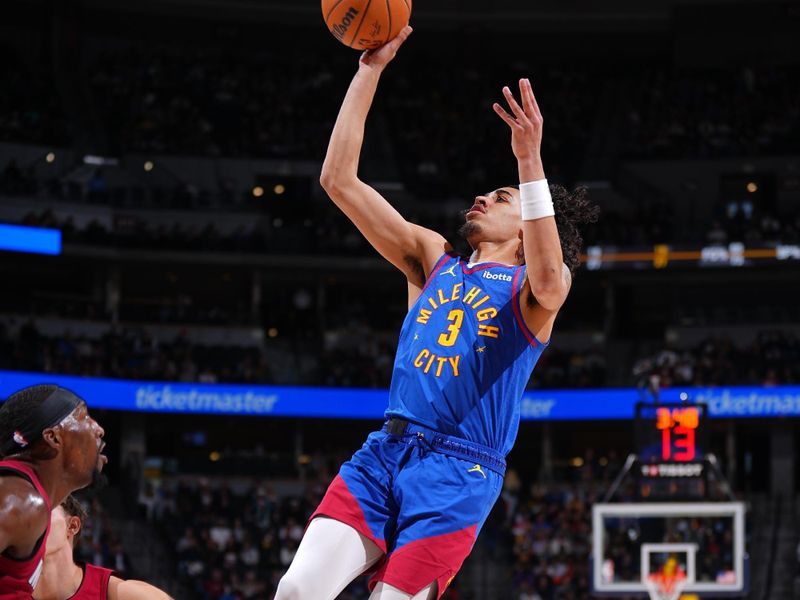 DENVER, CO - NOVEMBER 8: Julian Strawther #3 of the Denver Nuggets shoots the ball during the game against the Miami Heat on November 8, 2024 at Ball Arena in Denver, Colorado. NOTE TO USER: User expressly acknowledges and agrees that, by downloading and/or using this Photograph, user is consenting to the terms and conditions of the Getty Images License Agreement. Mandatory Copyright Notice: Copyright 2024 NBAE (Photo by Garrett Ellwood/NBAE via Getty Images)