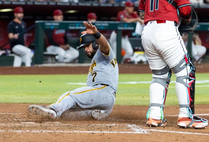 May 28, 2025; Phoenix, Arizona, USA; Pittsburgh Pirates infielder Isiah Kiner-Falefa scores in the sixth inning against the Arizona Diamondbacks at Chase Field. Mandatory Credit: Mark J. Rebilas-Imagn Images
