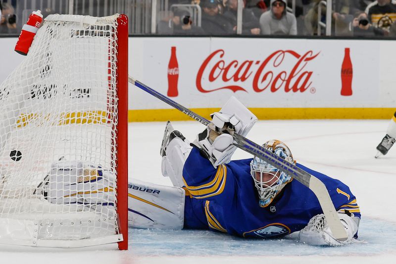 Dec 31, 2022; Boston, Massachusetts, USA; Buffalo Sabres goaltender Ukko-Pekka Luukkonen (1) dives across his crease but can t stop a shot by Boston Bruins right wing David Pastrnak for a goal during the first period at TD Garden. Mandatory Credit: Winslow Townson-USA TODAY Sports