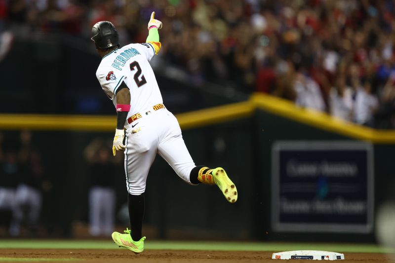 Oct 11, 2023; Phoenix, Arizona, USA; Arizona Diamondbacks shortstop Geraldo Perdomo (2) reacts after hitting a home run against the Los Angeles Dodgers in the third inning for game three of the NLDS for the 2023 MLB playoffs at Chase Field. Mandatory Credit: Mark J. Rebilas-USA TODAY Sports