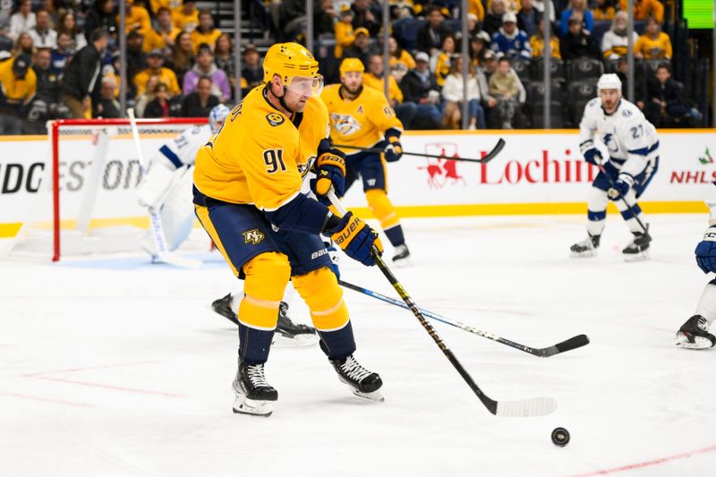 Nov 29, 2024; Nashville, Tennessee, USA;  Nashville Predators center Steven Stamkos (91) skates with the puck against the Tampa Bay Lightning during the second period at Bridgestone Arena. Mandatory Credit: Steve Roberts-Imagn Images