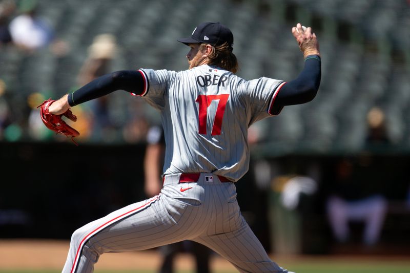 Jun 22, 2024; Oakland, California, USA; Minnesota Twins starting pitcher Bailey Ober (17) delivers against the Oakland Athletics during the eighth inning at Oakland-Alameda County Coliseum. Mandatory Credit: D. Ross Cameron-USA TODAY Sports