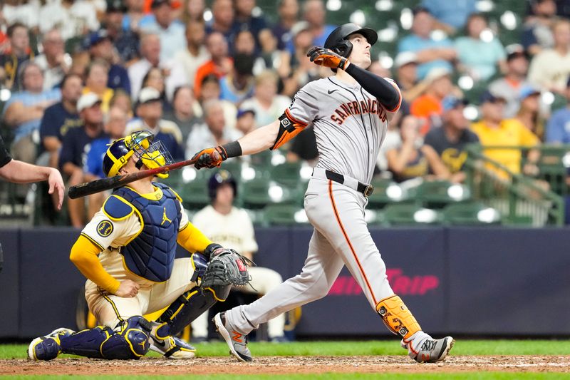 Aug 27, 2024; Milwaukee, Wisconsin, USA;  San Francisco Giants right fielder Mike Yastrzemski (5) hits a home run during the seventh inning against the Milwaukee Brewers at American Family Field. Mandatory Credit: Jeff Hanisch-USA TODAY Sports