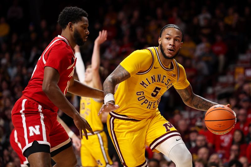 Jan 24, 2026; Minneapolis, Minnesota, USA; Minnesota Golden Gophers forward Jaylen Crocker-Johnson (5) works around Nebraska Cornhuskers forward Jared Garcia (15) during the first half at Williams Arena. Mandatory Credit: Matt Krohn-Imagn Images