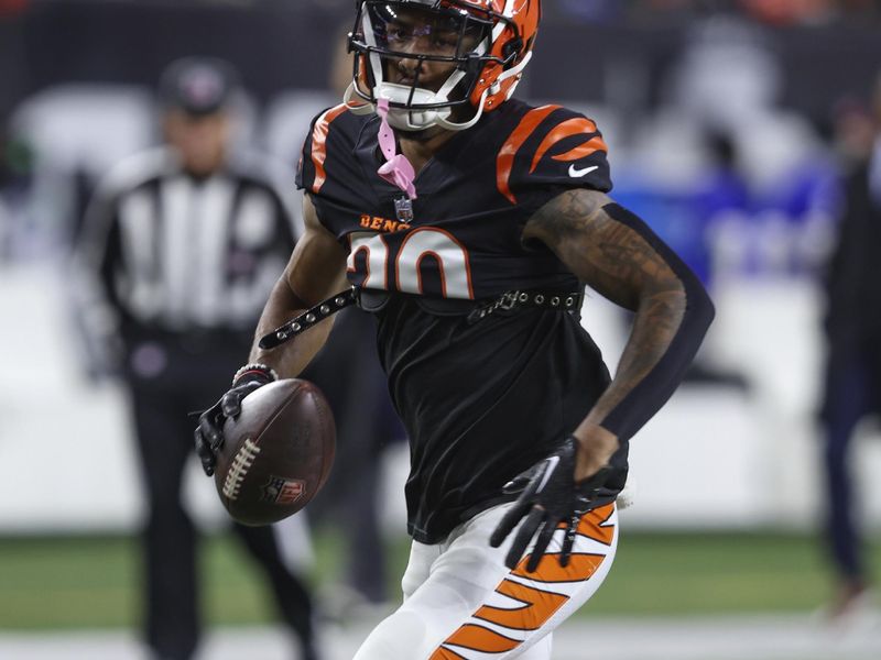 Cincinnati Bengals cornerback DJ Turner II (20) warms up before an NFL football game against the Buffalo Bills, Sunday, Nov. 5, 2023, in Cincinnati. (AP Photo/Gary McCullough)