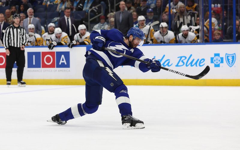 Dec 6, 2023; Tampa, Florida, USA; Tampa Bay Lightning defenseman Victor Hedman (77) passes the puck against the Pittsburgh Penguins during the third period at Amalie Arena. Mandatory Credit: Kim Klement Neitzel-USA TODAY Sports