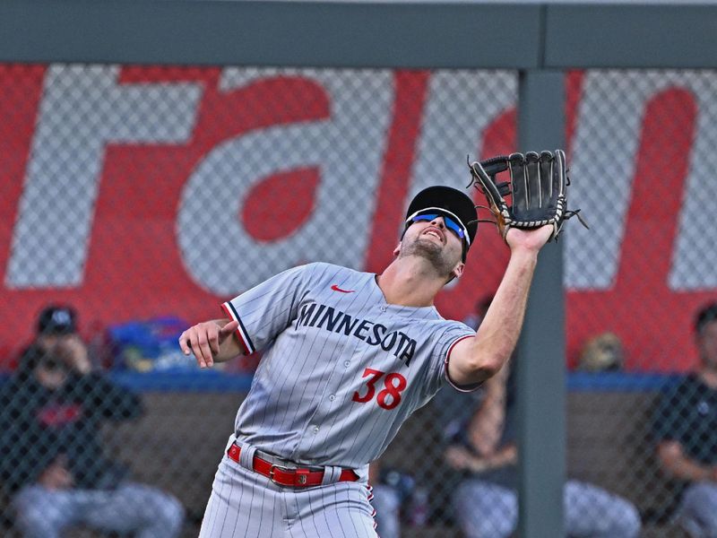 Jul 29, 2023; Kansas City, Missouri, USA;  Minnesota Twins left fielder Matt Wallner (38) catches a fly ball during the first inning against the Kansas City Royals at Kauffman Stadium. Mandatory Credit: Peter Aiken-USA TODAY Sports