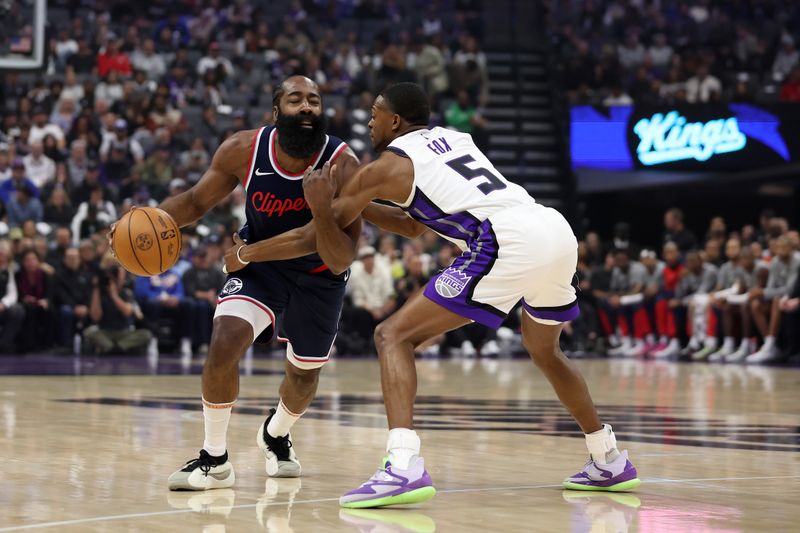 SACRAMENTO, CALIFORNIA - NOVEMBER 08: James Harden #1 of the LA Clippers is fouled by De'Aaron Fox #5 of the Sacramento Kings in the first half at Golden 1 Center on November 08, 2024 in Sacramento, California. NOTE TO USER: User expressly acknowledges and agrees that, by downloading and/or using this photograph, user is consenting to the terms and conditions of the Getty Images License Agreement.  (Photo by Ezra Shaw/Getty Images)