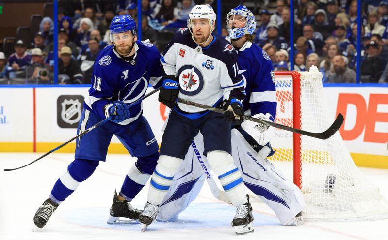 Jan 29, 2026; Tampa, Florida, USA; Tampa Bay Lightning defenseman Erik Cernak (81), Winnipeg Jets left wing Tanner Pearson (70) and Tampa Bay Lightning goaltender Andrei Vasilevskiy (88) look on to defend during the second period at Benchmark International Arena. Mandatory Credit: Kim Klement Neitzel-Imagn Images