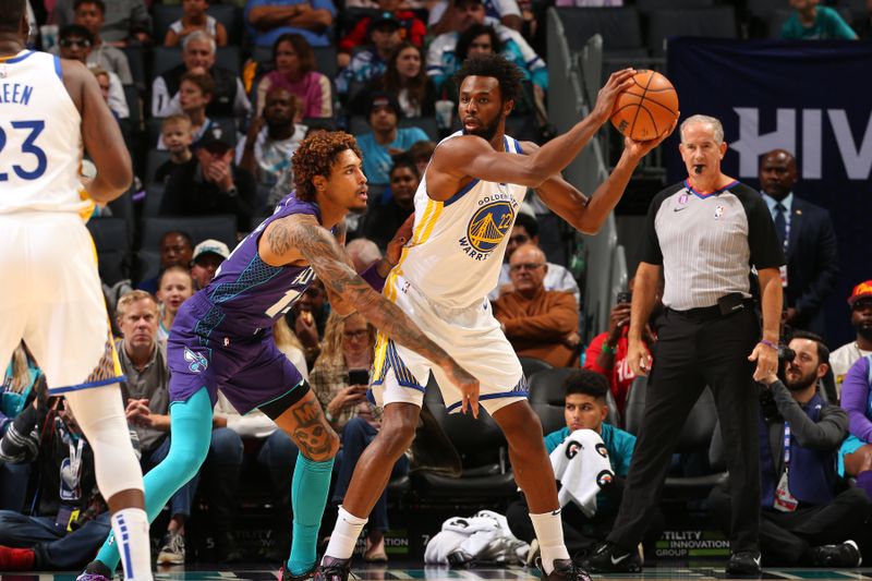 CHARLOTTE, NC -OCTOBER 29: Andrew Wiggins #22 of the Golden State Warriors handles the ball during the game against the Charlotte Hornets on October 29, 2022 at Spectrum Center in Charlotte, North Carolina. NOTE TO USER: User expressly acknowledges and agrees that, by downloading and or using this photograph, User is consenting to the terms and conditions of the Getty Images License Agreement. Mandatory Copyright Notice: Copyright 2022 NBAE (Photo by Kent Smith/NBAE via Getty Images)