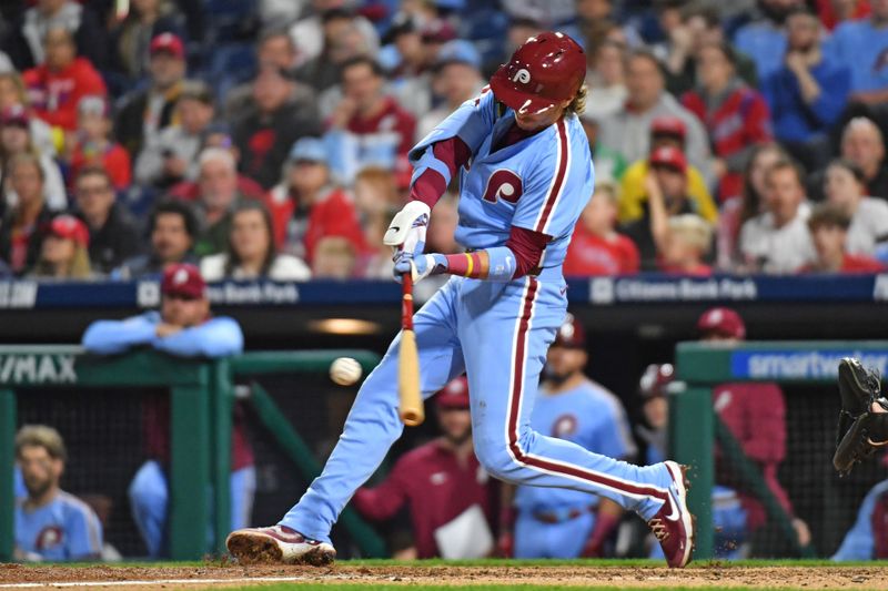 Apr 11, 2024; Philadelphia, Pennsylvania, USA; Philadelphia Phillies second base Bryson Stott (5) hits a two run home run against the Pittsburgh Pirates during the seventh inning at Citizens Bank Park. Mandatory Credit: Eric Hartline-USA TODAY Sports