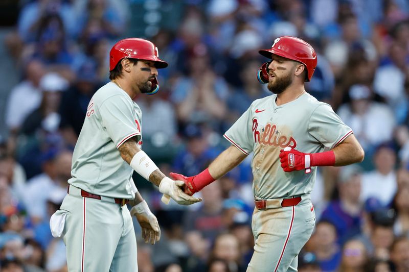 Jul 2, 2024; Chicago, Illinois, USA; Philadelphia Phillies second baseman Kody Clemens (2) celebrates with  outfielder Nick Castellanos (8) after scoring against the Chicago Cubs during the second inning at Wrigley Field. Mandatory Credit: Kamil Krzaczynski-USA TODAY Sports