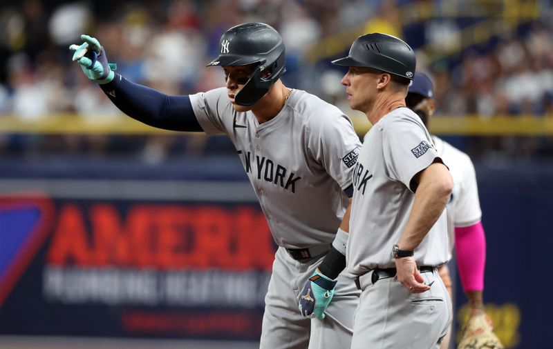 Jul 9, 2024; St. Petersburg, Florida, USA;  New York Yankees outfielder Aaron Judge (99) celebrates after he singles against the Tampa Bay Rays during the third inning at Tropicana Field. Mandatory Credit: Kim Klement Neitzel-USA TODAY Sports